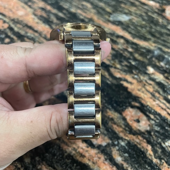 Tommy Hilfiger. Big round watch with glitter stones around it. - Picture 3 of 6